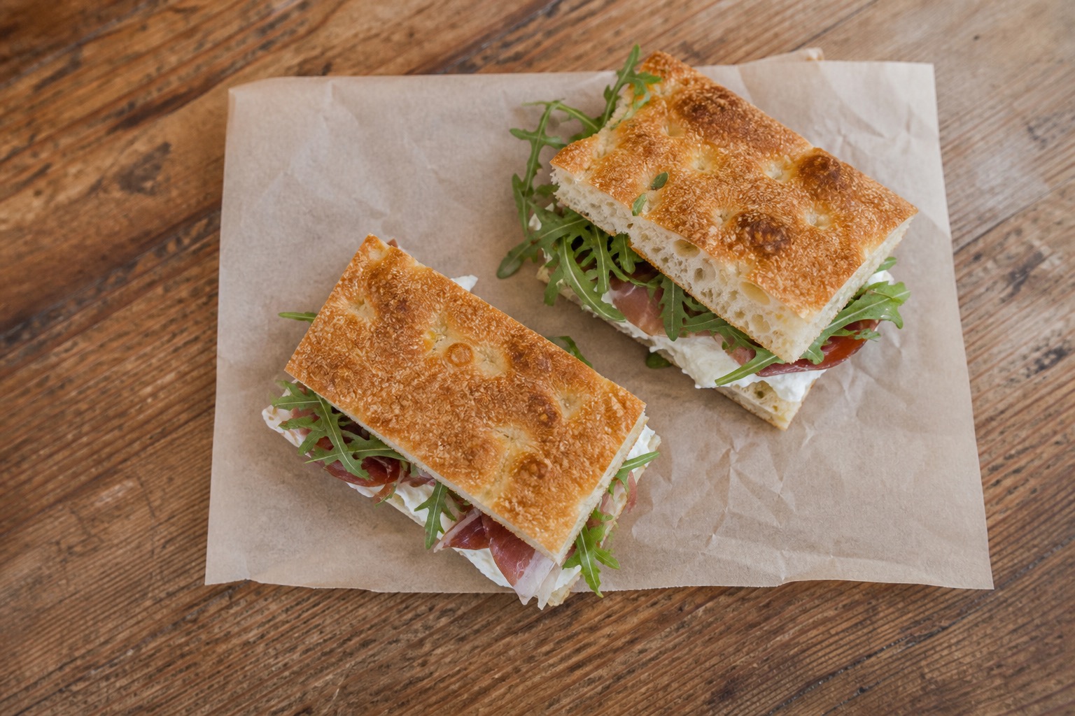 Philadelphia focaccia halves on parchment