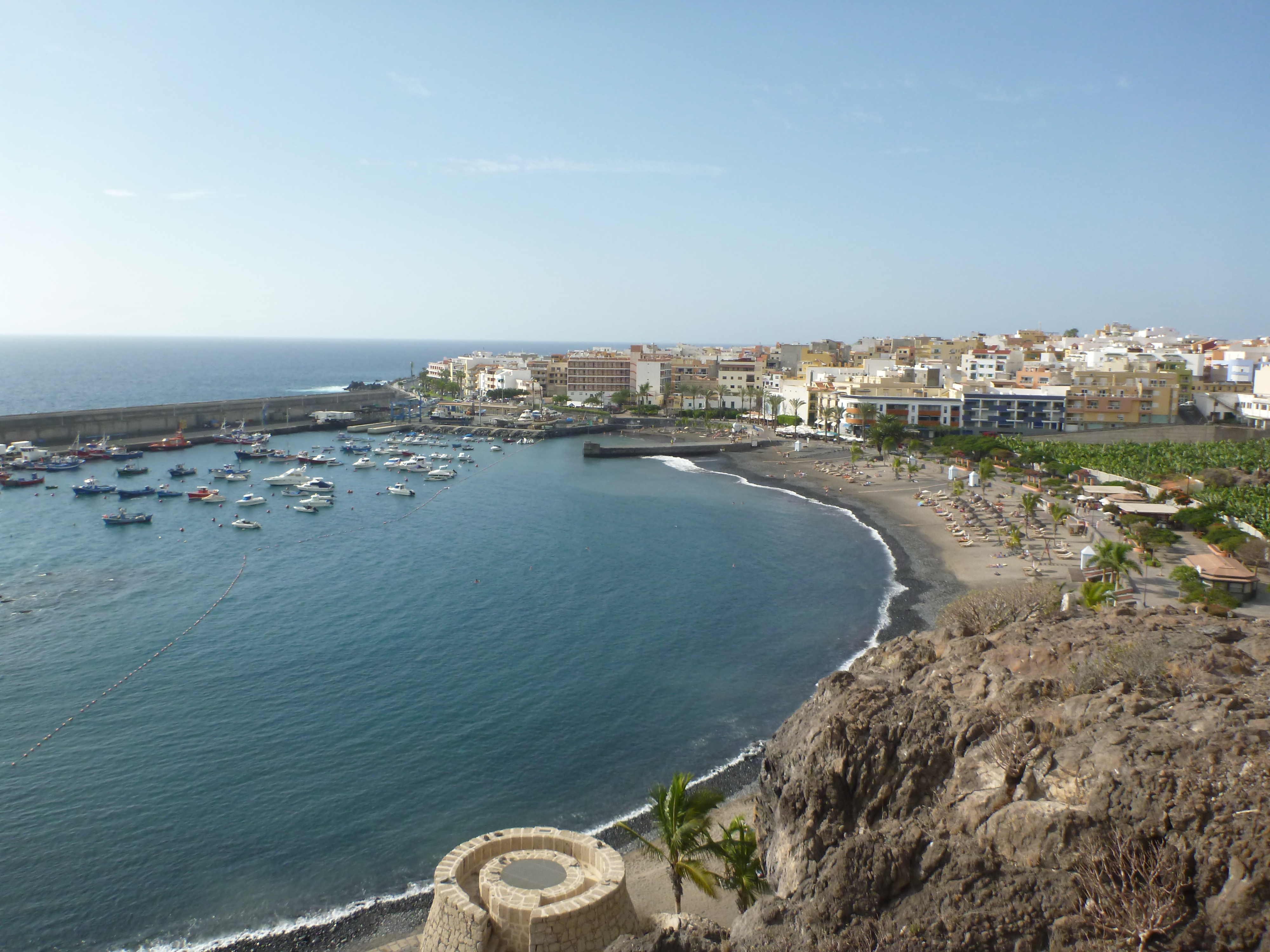 Overview of Playa de San Juan and its sheltered seafront in Guia de Isora.