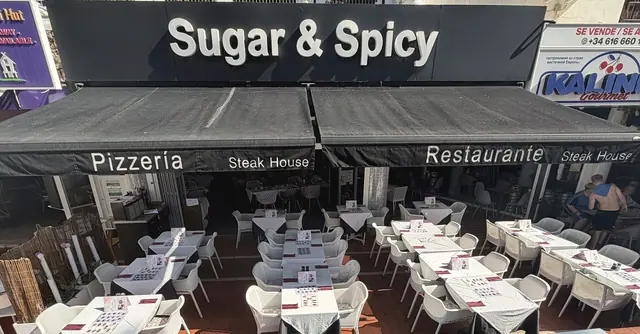 Sugar & Spicy Restaurant outdoor terrace and storefront in Playa de las Américas